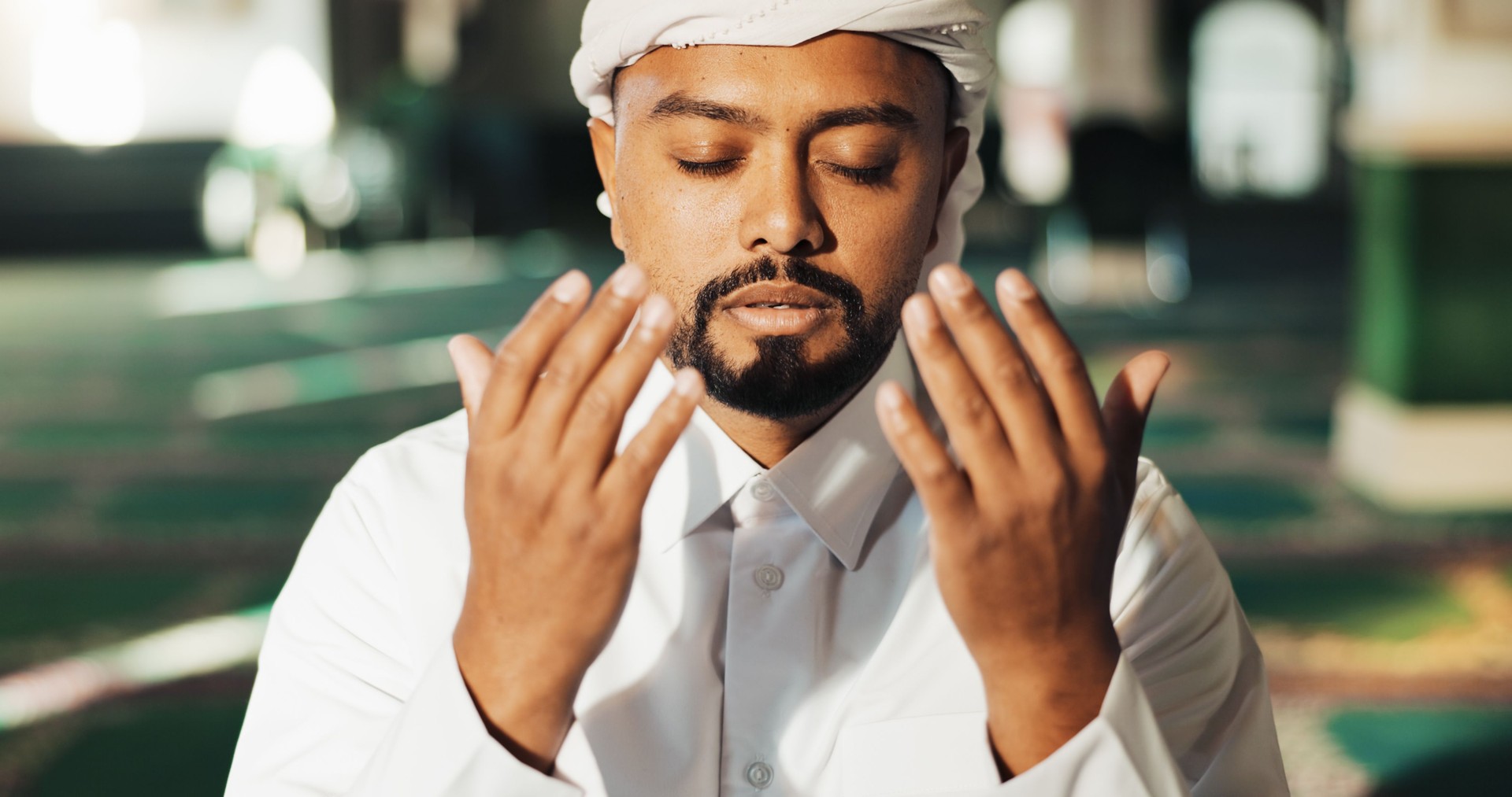 Islamic, man and hands in mosque for prayer, worship and gratitude to Allah for peace in morning. Muslim, male person and praise in temple for spiritual healing, mindfulness and faith in religion
